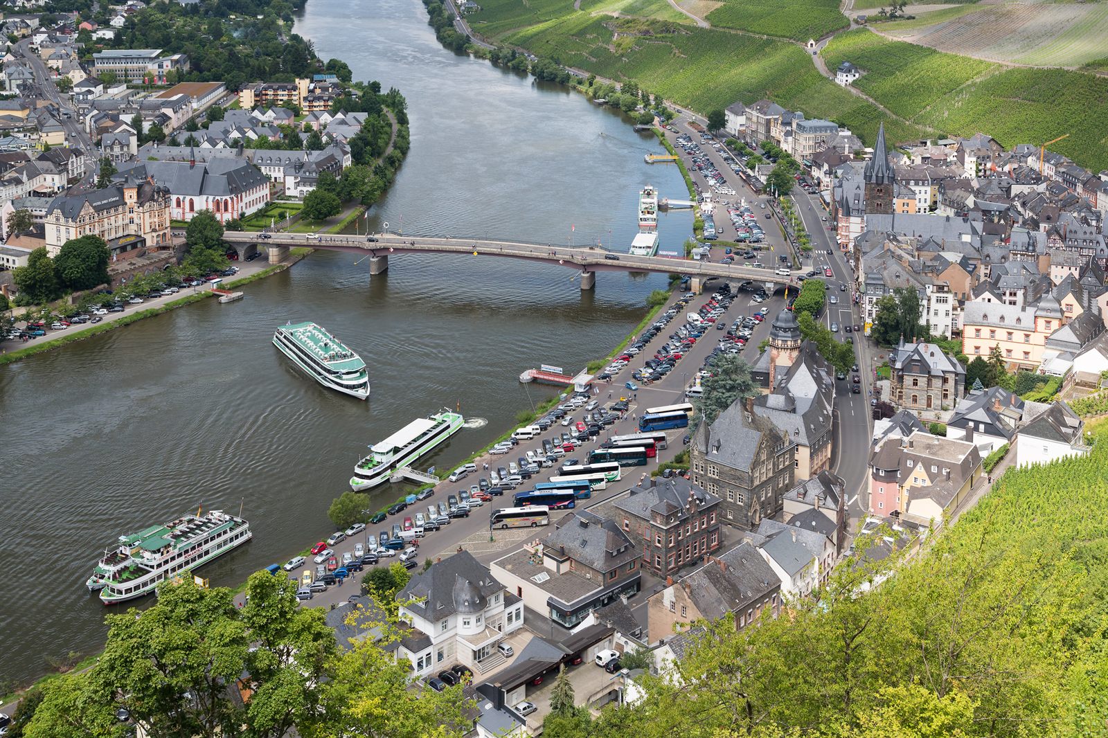 River cruise ships on the Moselle below the vineyards of Bernkastel